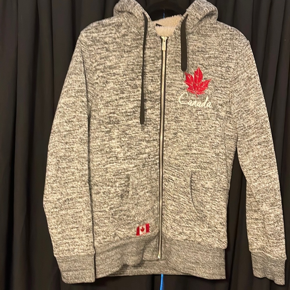 Canadian zip up jacket. Sherpa lined in the hood & body but not in the sleeves.